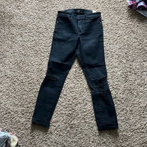 Abercrombie & Fitch Black skinny jeans with rips on knees. Size 4